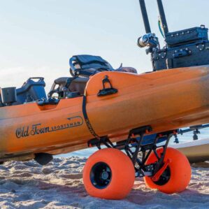 YakAttack Townstow Kayak Cart with orange pneumatic sand tires on the beach with a kayak. Available at Riverbound Sports in Tempe, Arizona.